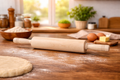 Wooden rolling pin on a wooden table with flour and dough in a kitchen setting.