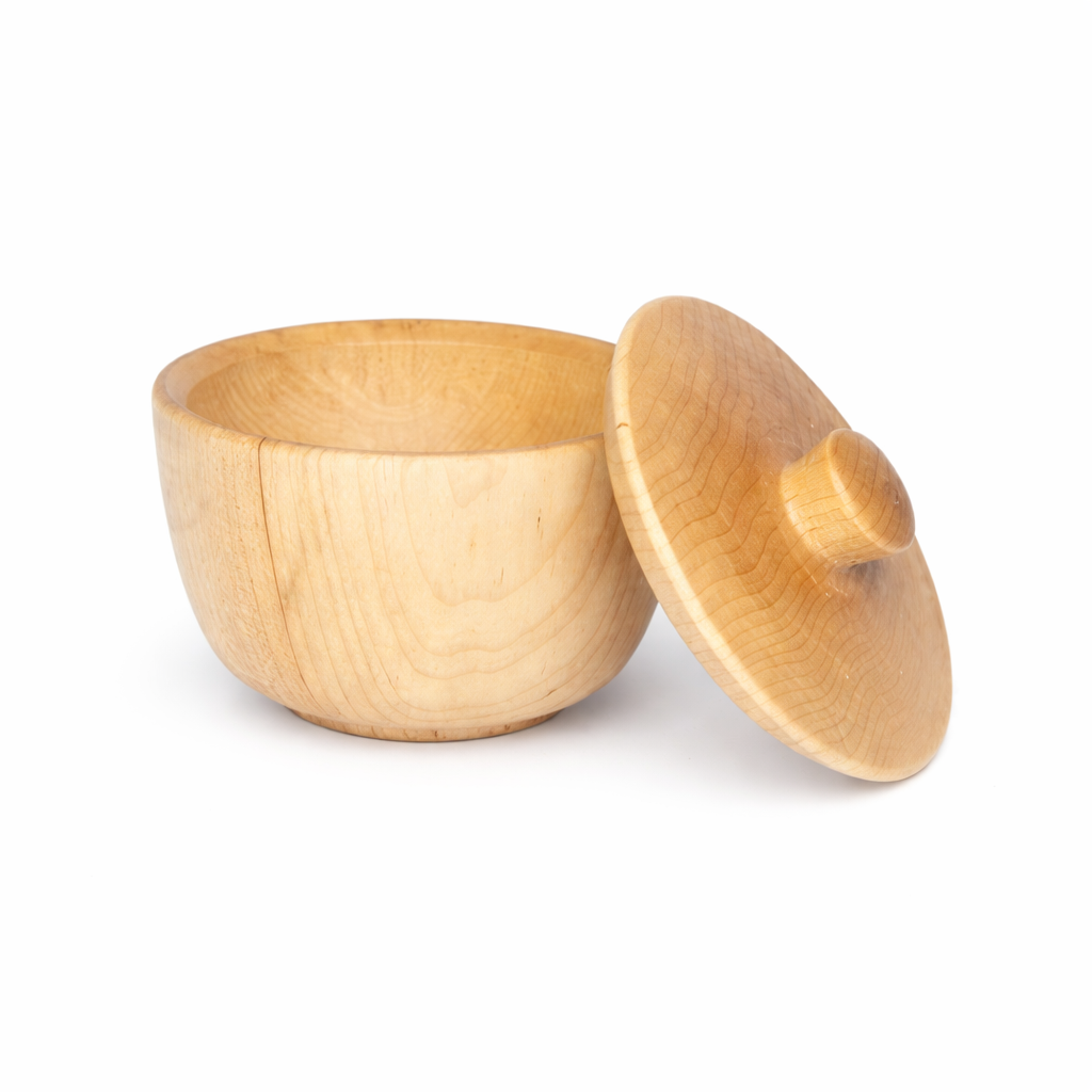 Wooden bowl with a lid on a white background